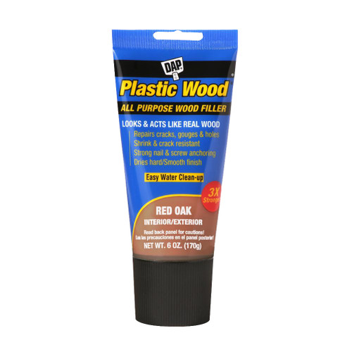 blue plastic tube of dap plastic wood all purpose wood filler in red oak color with black screw cap