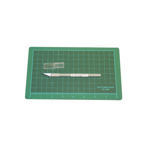 green rectangular cutting mat with grid pattern and K1 aluminum knife with #11 blade and safety cap