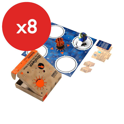 ozobot ozogoes to the sun, earth, and moon kit with completed projects on mat next to cards near box