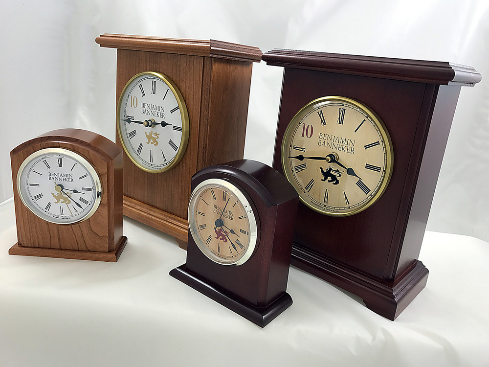 The smaller Banneker Clocks are the 3500 BC Desk Clock made from a solid block of American Cherry Wood.  The Larger clocks are the Hardaway shown in both Red Heat and Gold Medal color choices.  The Hardaway is available as a silent clock or with a chiming feature that recreates the classic chiming sounds of Grandfather Clocks.  