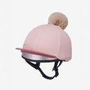 Stylish pink riding silk with a faux fur pom-pom on top and a shiny silver visor, designed for safety and fashion in equestrian sports.