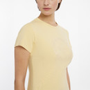 A woman wearing a fitted, short-sleeved yellow t-shirt featuring a subtle embossed logo design on the front.