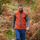 A view of a man wearing an orange Ridgeline fleece gilet A view of a man wearing an orange Ridgeline fleece gilet