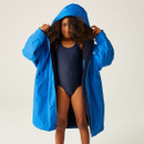 A girl wearing a bright blue robe over a swimming costume with the hood up.