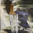 A close up of the water trickling down the water feature