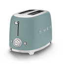 An emerald green SMEG toaster with a sleek design, featuring two slots, a chrome knob, and a 'stop' button.