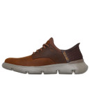 Brown casual shoe with a soft, flexible sole and knitted back. The shoe has brown laces and a modern design, conveying comfort and style.