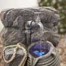 A close up of the tap on the water feature