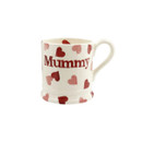 A side view of a white mug with pink and red hearts on it with "Mummy" written in red on a white background