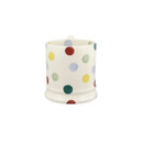 A front view of a white mug with multicoloured polka dots on a white background