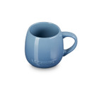 A light blue Le Creuset mug