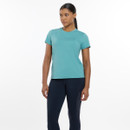 A woman stands confidently in a teal athletic t-shirt and navy leggings, showcasing a sporty and stylish outfit against a white background.