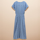 A blue midi dress featuring a colourful floral pattern, short sleeves, and an elastic waist, displayed against a soft beige background.