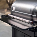 Traeger P.A.L. Pop-And-Lock XL front shelf attached to pellet grill