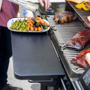 Using Traeger P.A.L. Pop-And-Lock XL front shelf to hold plated food beside barbecue