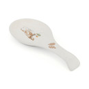 A view of a cooksmart forest fable ceramic spoon rest with an illustration of an owl on a white background