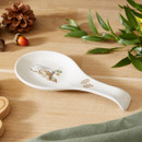 A view of a cooksmart forest fable ceramic spoon rest with an illustration of an owl on a table