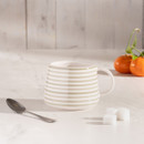 A view of a grey striped Mary Berry mug on a table