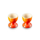 Two orange egg cups with a cream inner