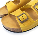 A close up of the buckle on the sandal