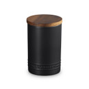 A black storage jar with wooden lid.