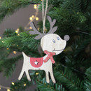 A view of a wooden reindeer hanging decoration with a red scarf hanging on a Christmas tree