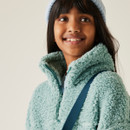 A close up front view of a fluffy green quarter zip fleece