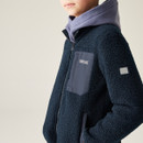 A close up side view of a navy regatta full zip fleece