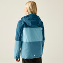 Rear view of a person wearing a two-toned blue jacket with a hood. The jacket has a darker top and lighter bottom. The person has blonde hair.