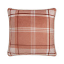 A view of a green cushion with a deer and foliage design on a white background