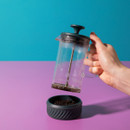 Someone lifting the cafetière off the base.