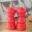 A set of two red salt or pepper mills