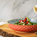 The bowl filled with food on a table.
