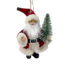 A festive Santa Claus figurine in a red suit, holding a small green Christmas tree, with a joyful expression.
