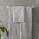 A view of a silver Catherine Lansfield Zero Twist Cotton Hand Towel on a rail
