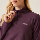 A close up view of the quarter zip neckline.