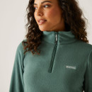 A close up view of the quarter zip neckline.