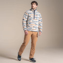 Full-body view of man in patterned beige fleece pullover and tan hiking trousers. Full-body view of man in patterned beige fleece pullover and tan hiking trousers.