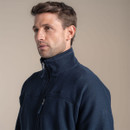 Quarter-zip fleece showcasing raised collar for added warmth and embroidered sleeve logo.