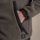 Close-up of khaki fleece jacket pocket with black trim and Craghoppers logo patch.