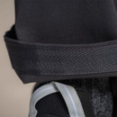 Reinforced ankle hem of men’s grey outdoor trousers for durability during hiking.