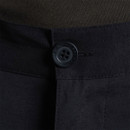 Close-up of button fastening with Craghoppers branding on men’s black trousers.