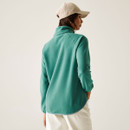 The back of a woman wearing a green fleece.