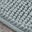 A close up view of a sage Catherine Lansfield bobble bath mat