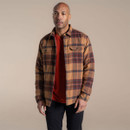 Men's casual check flannel jacket styled with a red T-shirt and black trousers.
