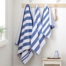 A view of blue striped Bianca Fine Linens hand towel, bath towel, bath sheet hung on hooks A view of blue striped Bianca Fine Linens hand towel, bath towel, bath sheet hung on hooks