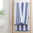 A view of blue striped Bianca Fine Linens bath towel a hook A view of blue striped Bianca Fine Linens bath towel a hook