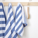 A view of blue striped Bianca Fine Linens hand towel a hook A view of blue striped Bianca Fine Linens hand towel a hook
