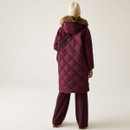 The back of a woman wearing a quilted, fig coloured jacket with a faux fur hood.