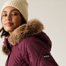 A close up view of the side of the padded hood with faux fur trim.